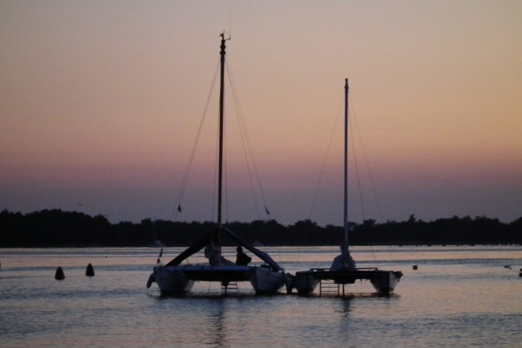 Two catamarans sailing along Istria